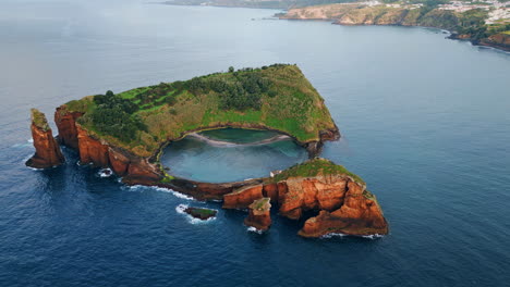 isolated island seascape drone shot. breathtaking rocky cape with sea lagoon