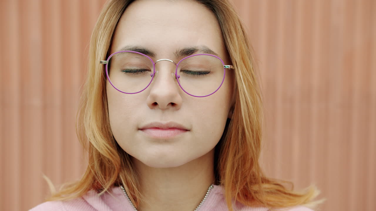 Woman with Closed Eyes and Purple Glasses