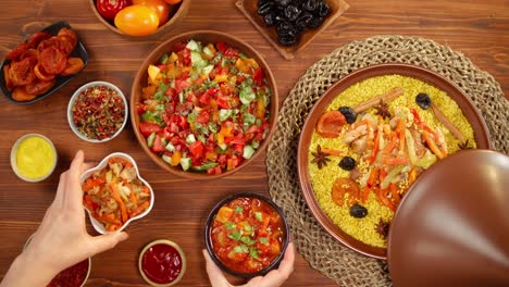 moroccan cuisine top view. tajine, traditional dish made of lamb and eggplant, vegetable salad. middle eastern culture. couscous with mutton close-up, delicious rice. homemade food.