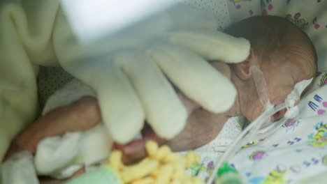 hospitalized newborn baby receiving care