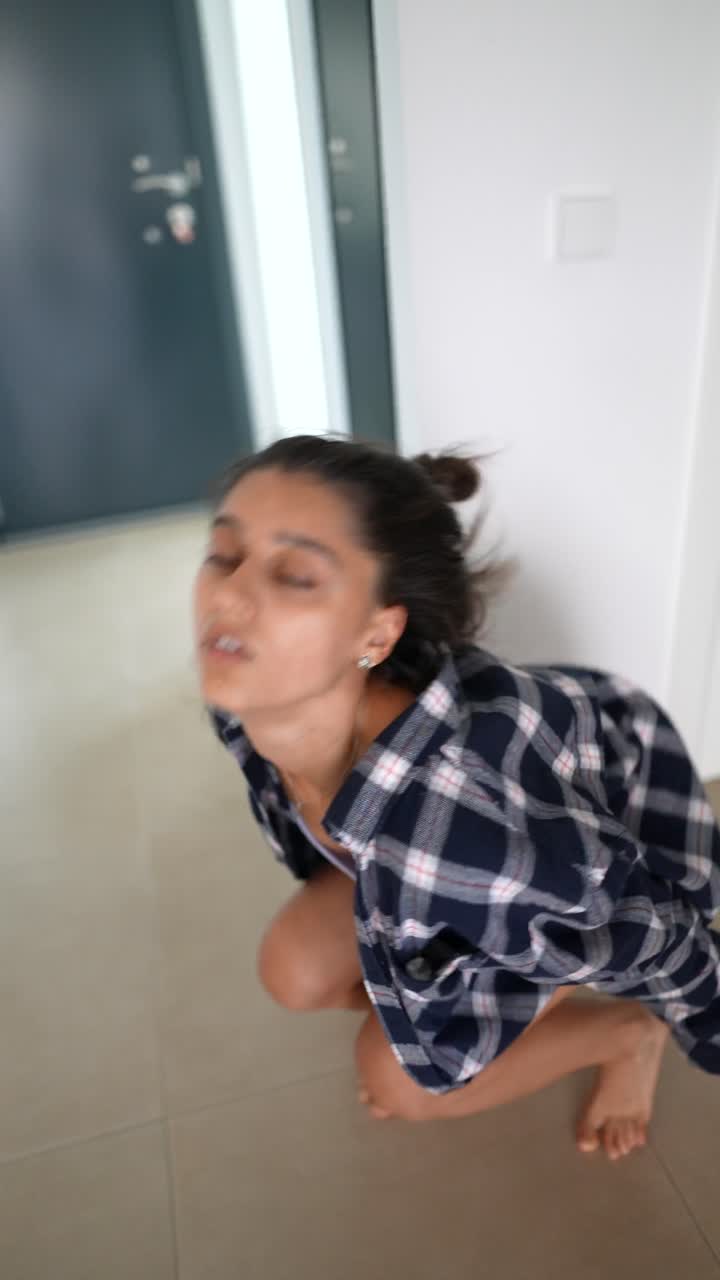 Young Woman Dancing in a Room