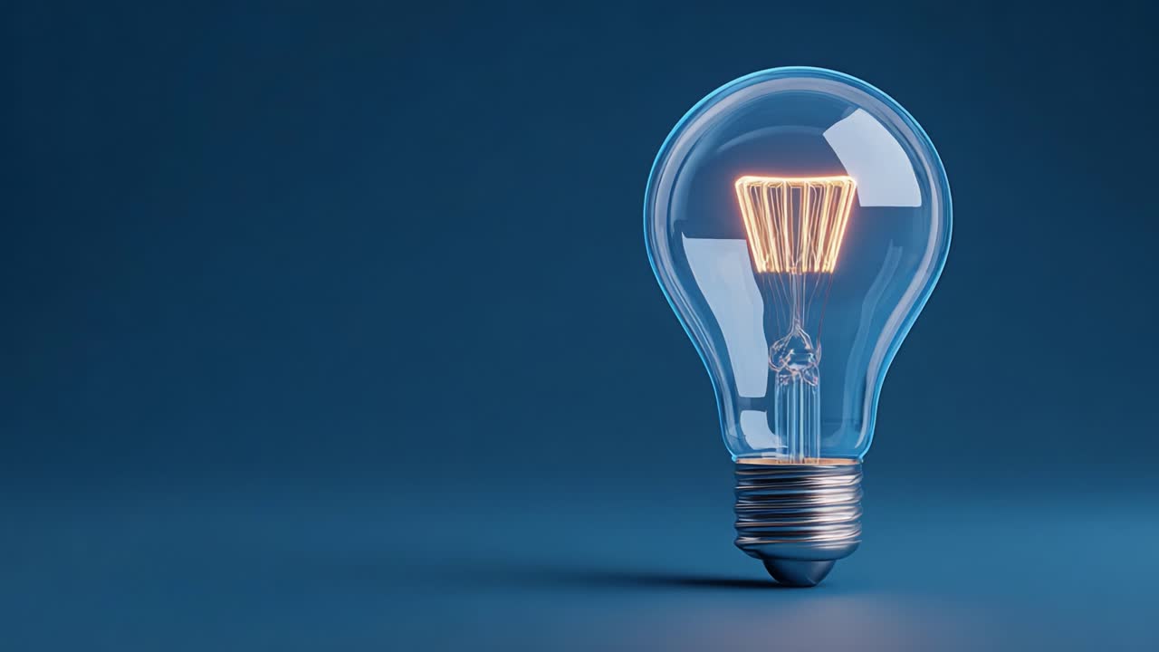 Illuminated Light Bulb with Glowing Filament Casting Soft Light on a Blue Background, Symbolizing Innovation and Creativity