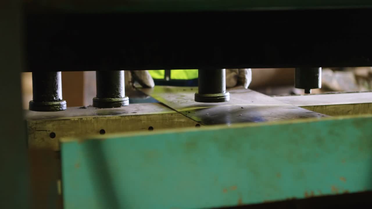 Male worker working on machine in warehouse 4k