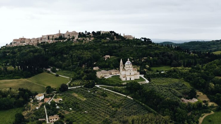 Wide aerial view of Italy's countryside prominently featuring the Sanctuary of the Madonna