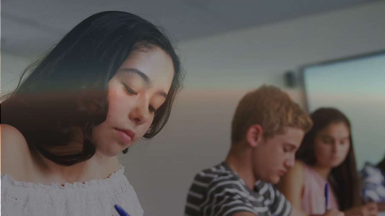 Teenage female left taking notes for class, overlays emerging over students into globes and charts