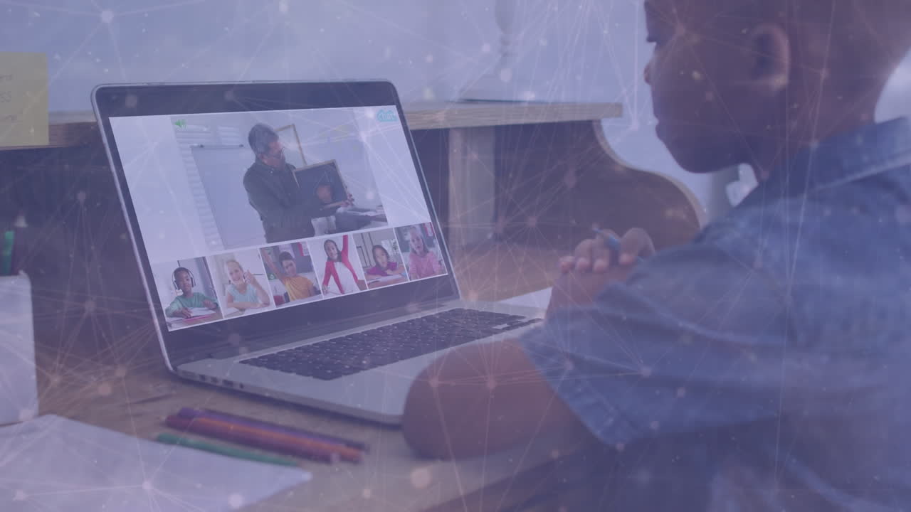 Animation of network of connections over african american boy using laptop for online school lesson