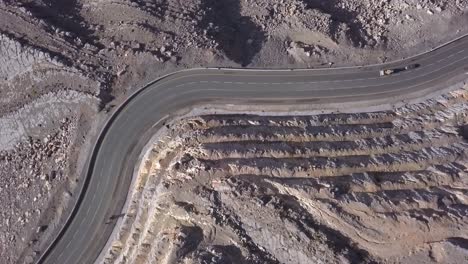 desert road at jebel jais mountain united arab emirates - aerial shot