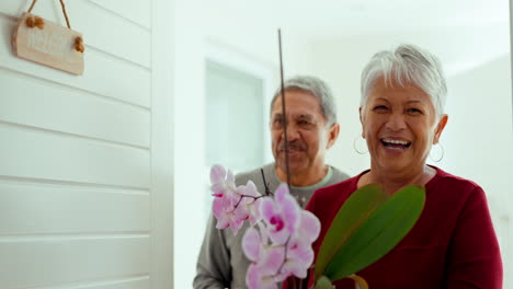 senior man, woman and front door for welcome