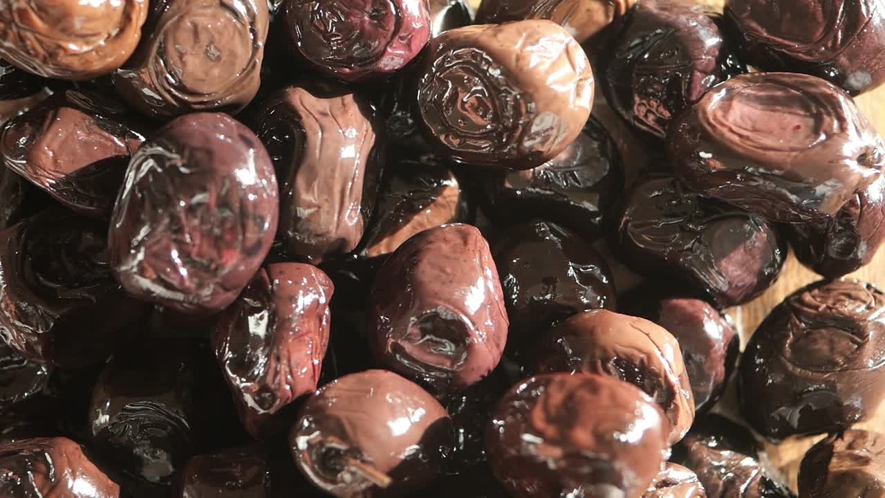 Close-up of a pile of cured black olives