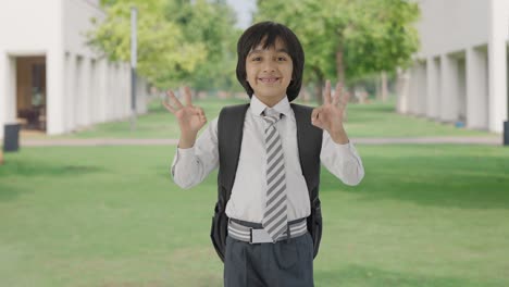 Happy-Indian-school-boy-showing-okay-sign