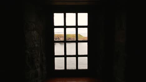 Looking-out-of-Dunnottar-Castle,-Scotland,-United-Kingdom