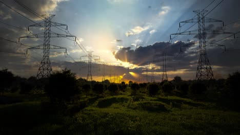power lines at sunset over a field