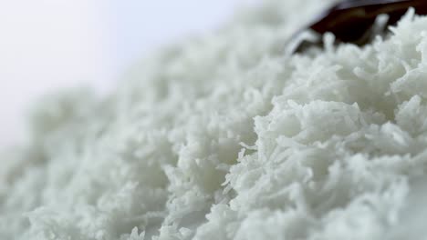 Chocolate-syrup-pouring-over-shredded-coconut