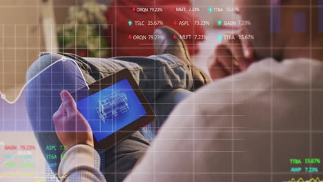 animation of financial data processing over caucasian man using tablet