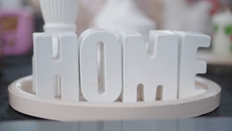 white letters spelling out home on a tray