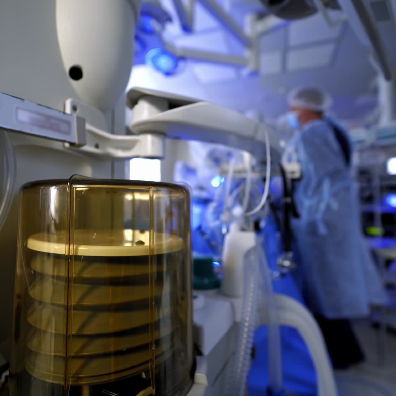Life support equipment in clinic. Motion of medical device for artificial lungs ventilation on the background of surgical process. Covid-19.