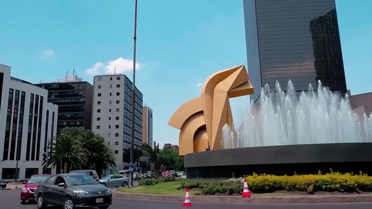 Abstract urban sculpture of Torre del Caballito on busy city street of Paseo La Reforma. Mexico City. Mexico.