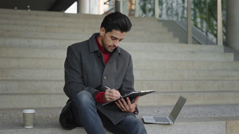 Man working on stairs outdoors