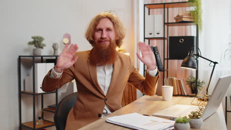 POV-of-business-man-employee-waves-hand-hi-gesture-greeting-welcomes-someone-online-office-webinar