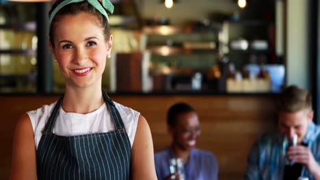 Portrait-of-waitress-noting-order-on-notepad