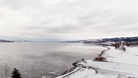 revealing vast freezing lake on cloudy winter day