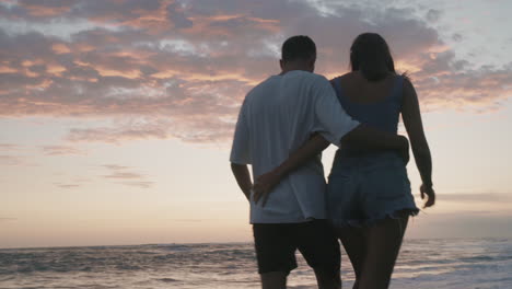 romantic couple walking on sunset