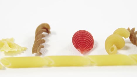 various pasta on white background