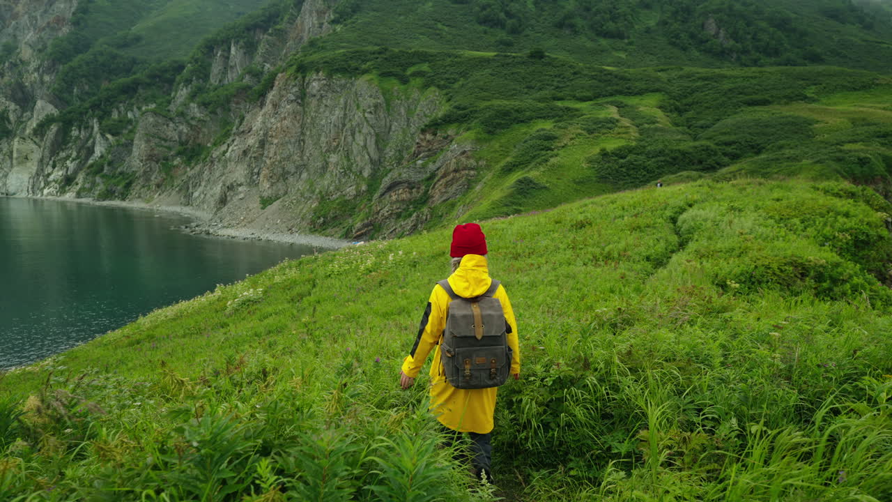 Woman Hiking on a Coastal Path