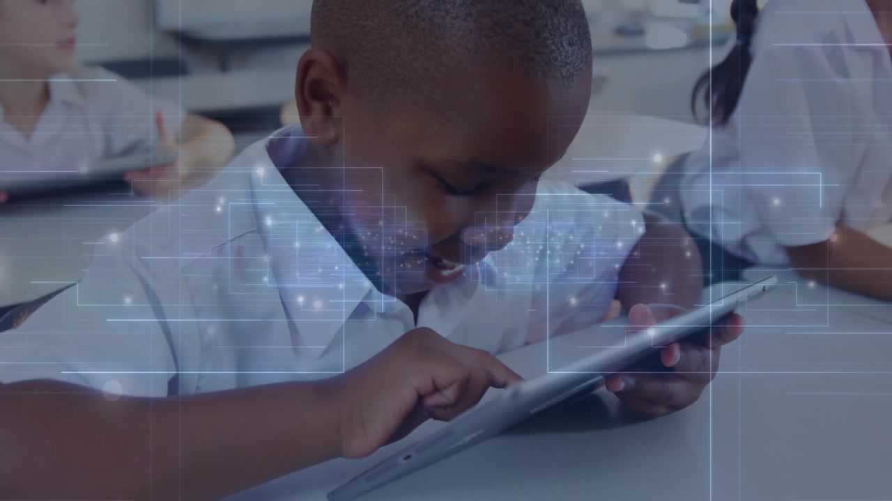 boy picking up tablet and tapping icon for education navigating lesson with translucent overlay