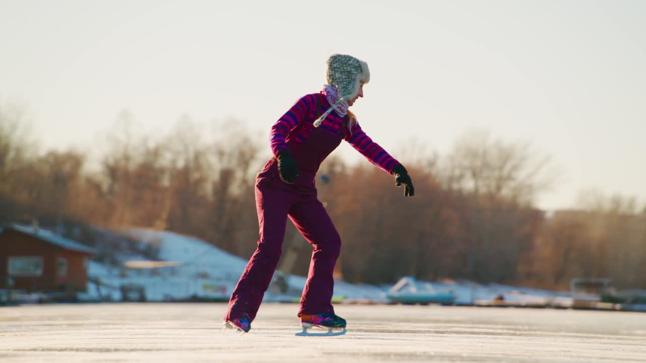 Woman ice skating on a frozen lake