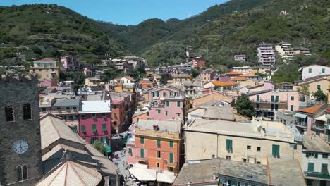 backwards drone shot reveals monterosso italy in cinque terre on typical summer day