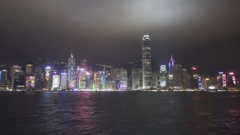 hong kong at night. boats in the victoria harbour
