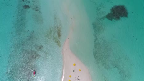 Aerial-footage-sandbank-tropical-island-with-crystal-clear-waters-ocean-view-and-beach-paradise