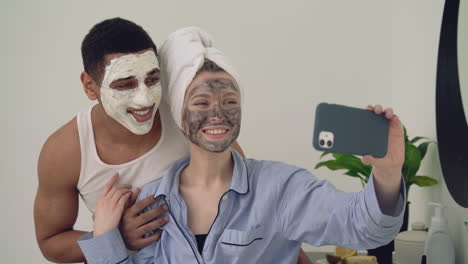 interracial couple with facial mask taking a selfie 1