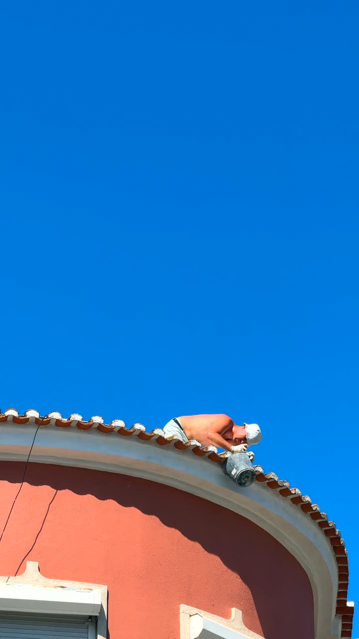 Worker on a Roof