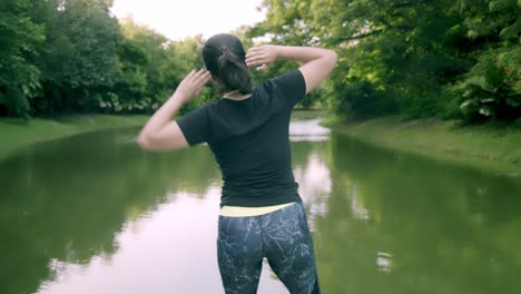 Asian-woman-exercise-in-park-outdoor-with-new-normal-in-COVID-19-situation