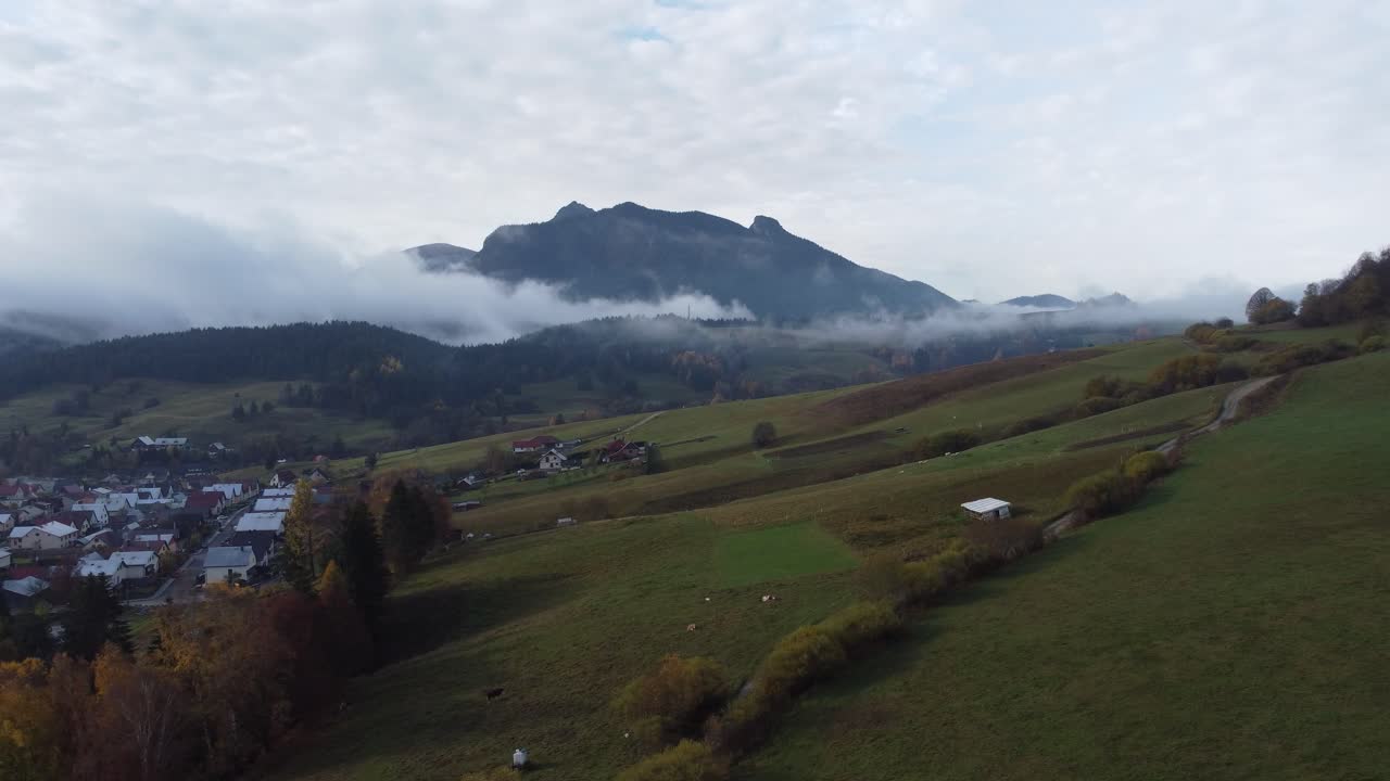 This captivating drone video in stunning 4K resolution offers a bird's-eye view of the hills, village church and its peaceful surroundings