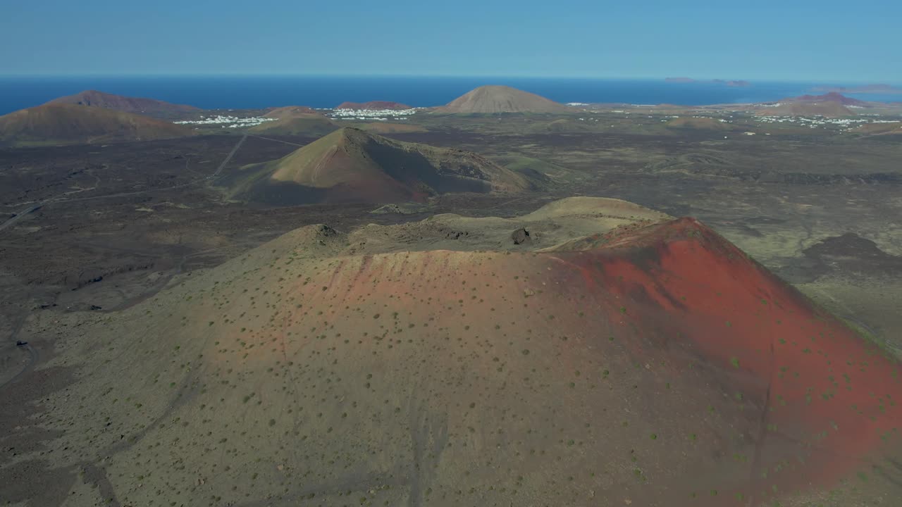 Aerial drone view of mountain sea and volcanoes in Lanzarote, Canary Islands, Spain