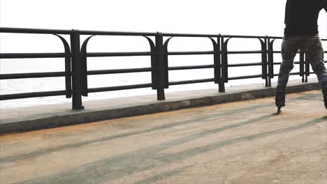 person rollerblading on a coastal walkway