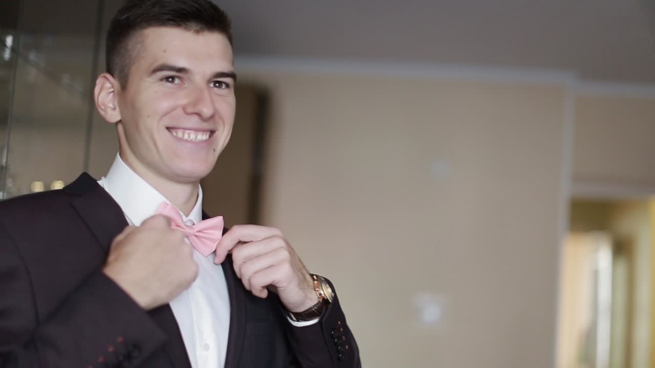 Elegant Groom In Wedding Jacket. Handsome groom in suit. Wedding morning