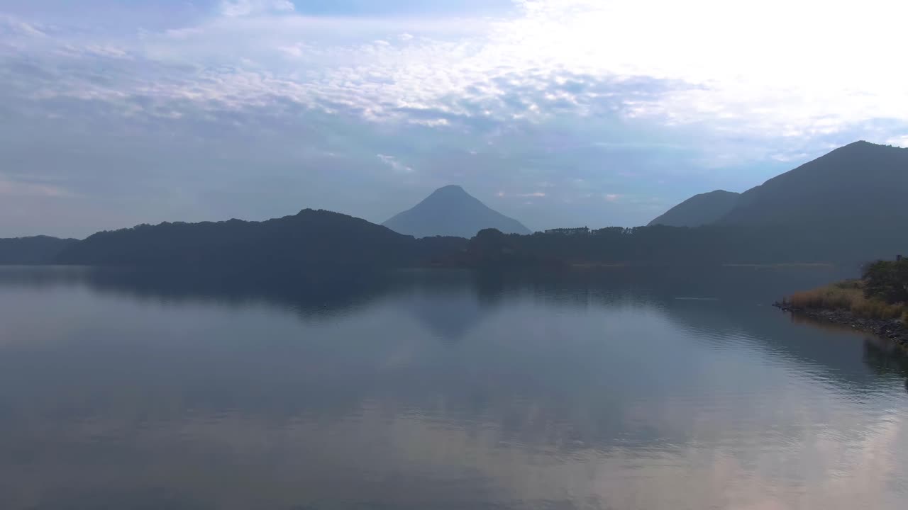 Flying Past Yellow Nanohana Flowers Towards Ikeda Lake and Kaimondake Mountain
