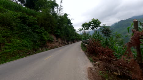 driving on winding mountain road of ha giang, vietnam - pov