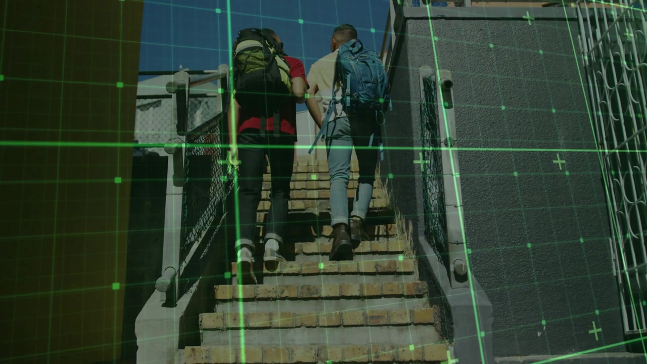 Two men emerging at stair base and climbing under AR grid overlay, tracking shifting backpacks