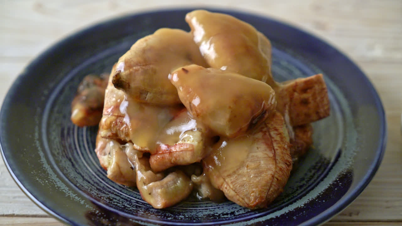 grilled bananas with coconut caramel sauce on plate