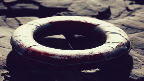 very old abandoned grungy lifebuoy