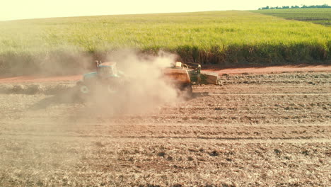 sugar cane straw baler working in the field after harvesting the crop