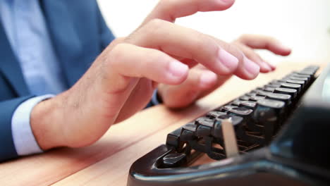 businessman typing on typewriter