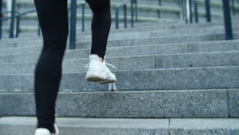 closeup female feet running upstairs