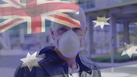 Animation-of-flag-of-australia-waving-over-caucasian-man-wearing-face-mask-in-city-street