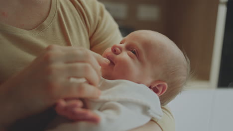 mother holding a newborn baby